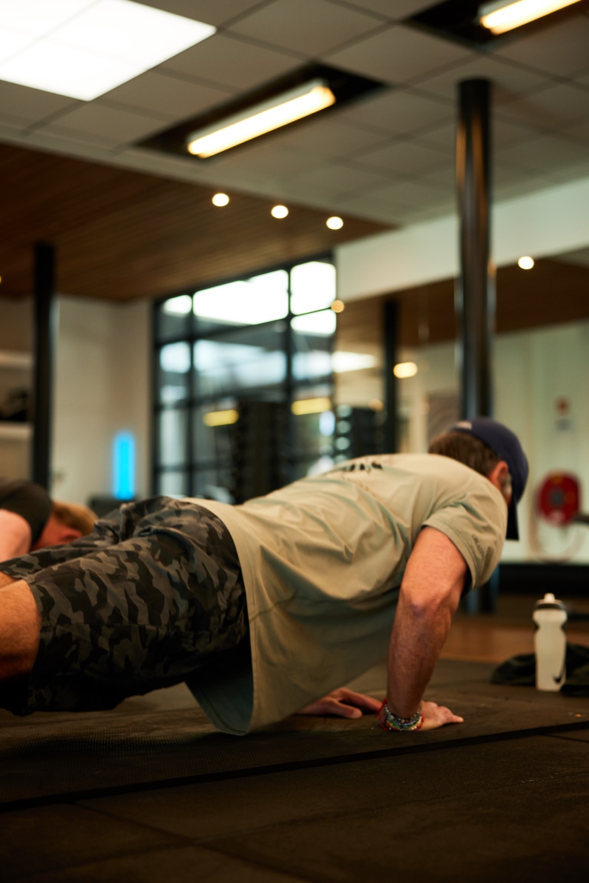 Member doing a plank on the training floor